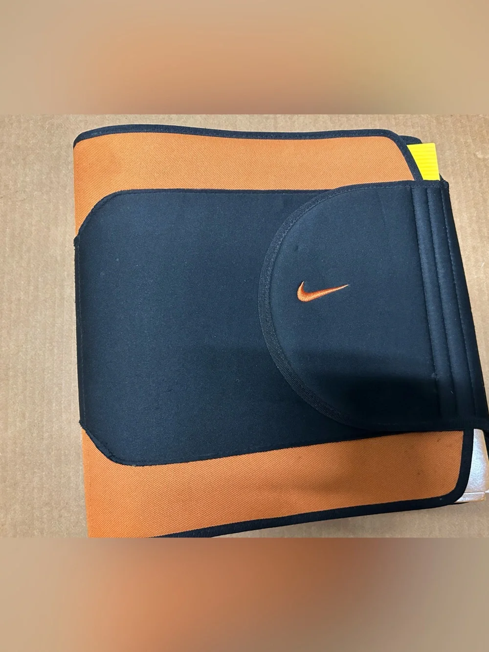 Nike 3 ring binder w/ 2 Nike folders.  Orange & black. Adhesive closure.